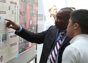 Student presenting at a poster session.