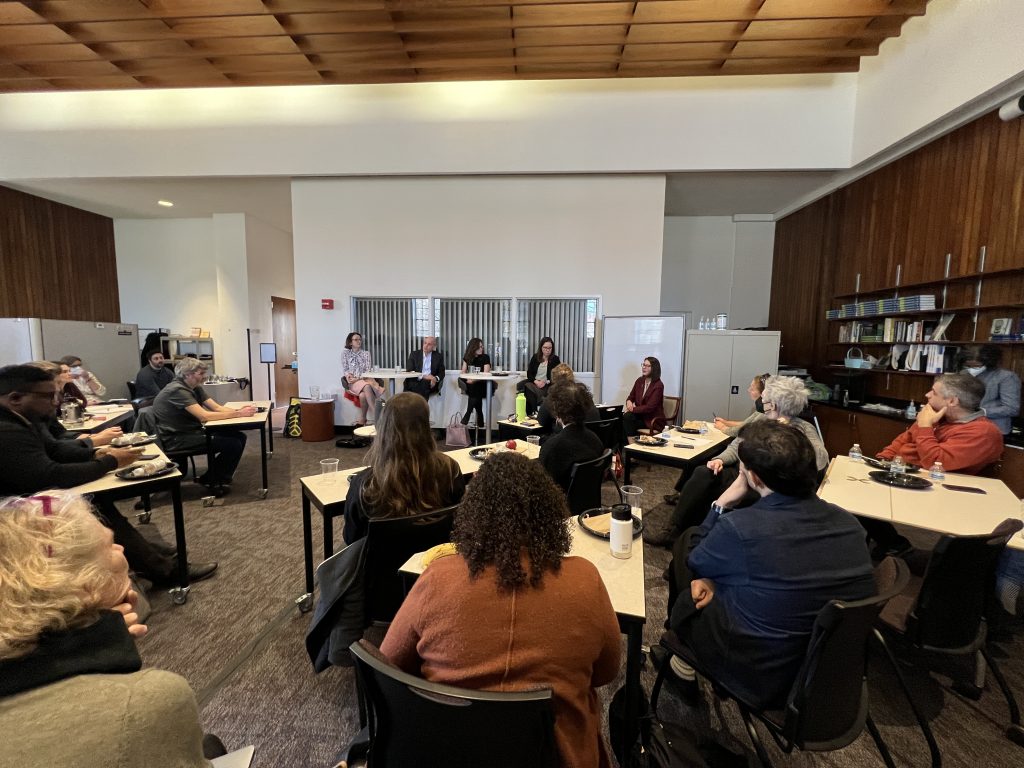 A group of faculty listening to Lunch and Learn panelists.