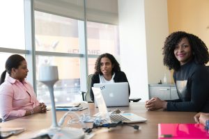 College-level students having a discussion sitting around a table