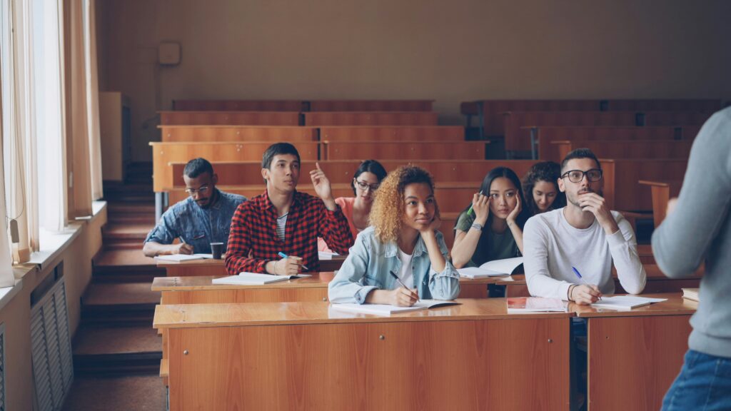 groups of students in large lecture hall