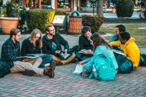 group of students sitting outside